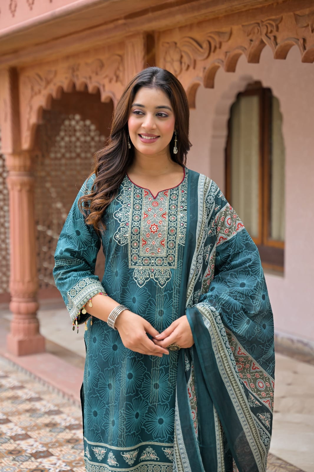 Close-up of elegant yoke embroidery and tassel detailing on a 3/4th sleeve printed kurti.