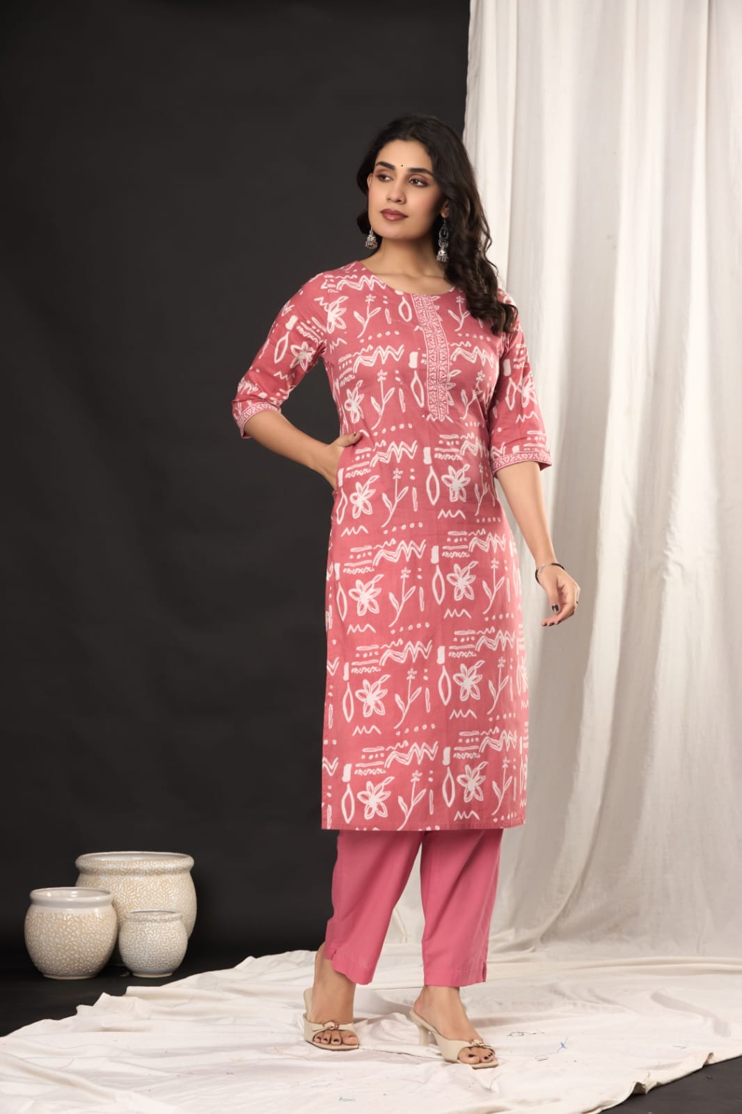 "Women's daily wear pink kurti with matched palazzo and dupatta." (Focuses on the full outfit for daily wear context.)